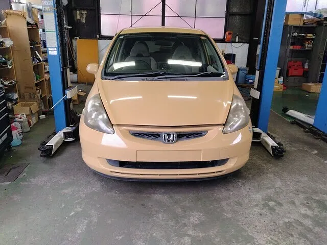 周南市　フィット　走行時異音　ミッションマウント